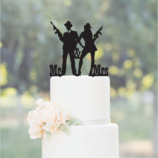 black acrylic with two people holding guns with mr and mrs at the bottom.